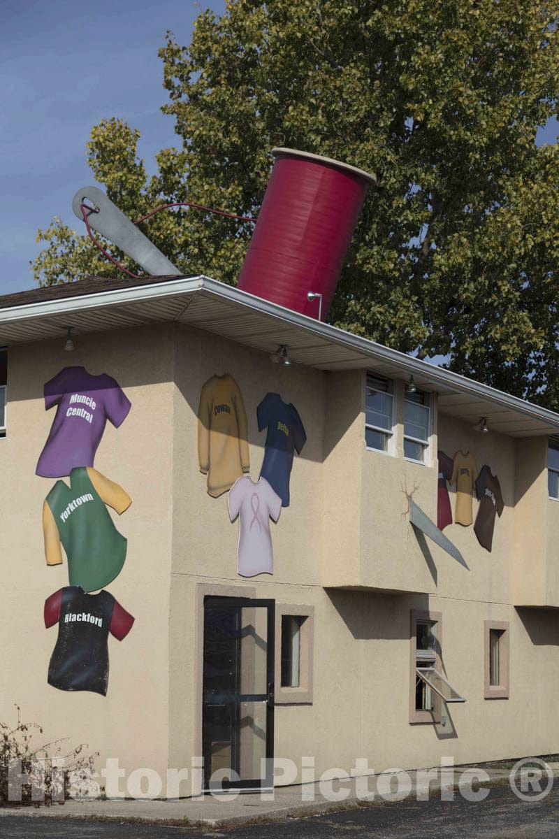 Photograph- A Most Unusual Twist, a Spool of Thread on The roof and a Needle Stuck Clear Through The Building, at The Outfitter Screen Printing Store, which Prints T-Shirts, in Muncie, Indiana