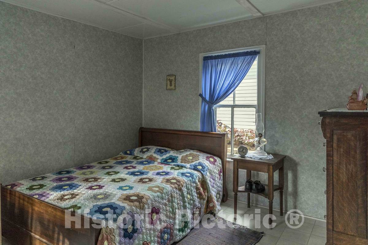 Photograph- Bedroom inside the farmhouse at Yoder's Amish Home, an authentic Amish farm that began accepting visitors in 1983 near Walnut Creek in central Ohio, along the"Amish Country Byway"