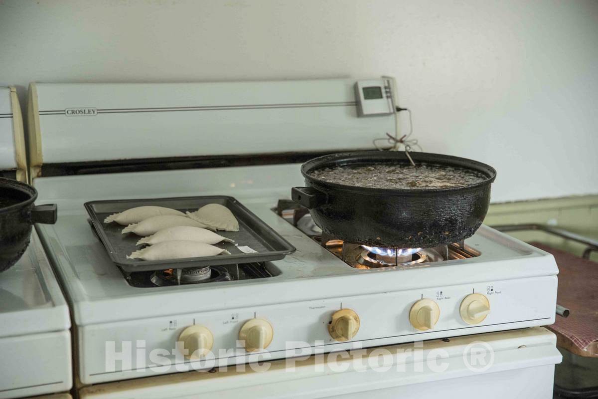Photograph- Small pies, before and during frying, inside the farmhouse at Yoder's Amish Home, an authentic Amish farm that began accepting visitors in 1983 near Walnut Creek in central Ohio