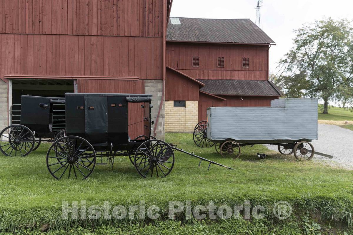 Photo- Barns and Horse-Drawn Buggies and Farm Wagons at Yoder's Amish Home, an Authentic Amish Farm That Began Accepting Visitors in 1983 Near Walnut Creek in Central Ohio