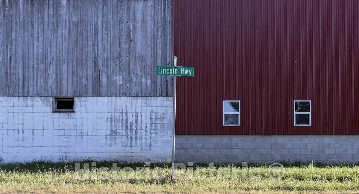 Photo - A road sign designating the old Lincoln Highway next to a barn outside Bucyrus, a small city in central Ohio that lies along the historic, originally two-lane