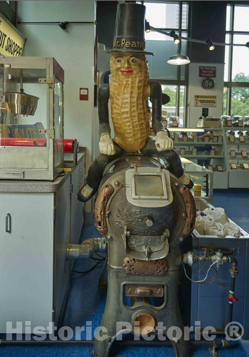 Photo - A Frisky-Looking Mr. Peanut Figure Sits ATOP an Early nut-Roasting Machine at The Peanut Shoppe nut purveyor's Store in Downtown Columbus, Ohio
