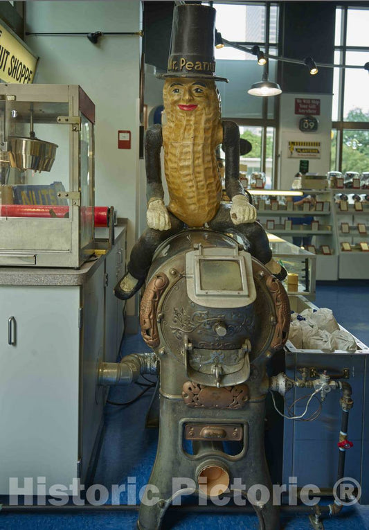 Photo - A Frisky-Looking Mr. Peanut Figure Sits ATOP an Early nut-Roasting Machine at The Peanut Shoppe nut purveyor's Store in Downtown Columbus, Ohio