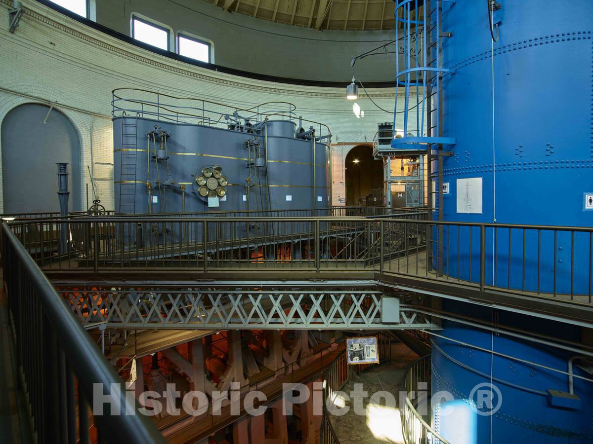 Photo- One of four triple-expansion, crank-and-flywheel water-pumping steam engines (right) at the Old River Station, part of the Greater Cincinnati Water Works in Cincinnati, Ohio