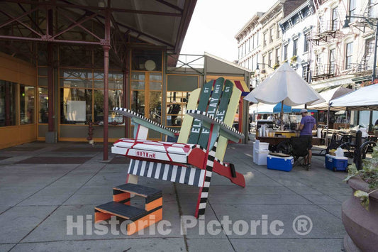 Photo- A greatly oversized beach chair as art outside Findlay Market, a historic public market in the now-gentrified (in 2016) Over-the-Rhine neighborhood of Cincinnati, Ohio