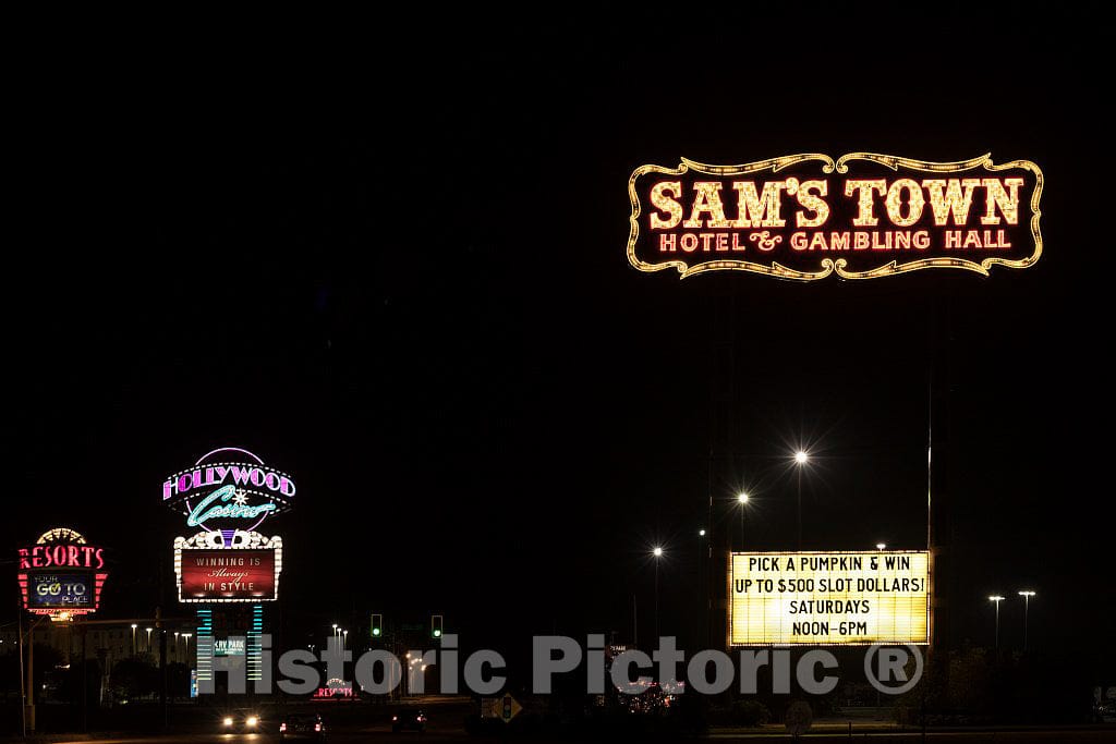 Photograph - A series of gaudy casinos light up the night in what, in daylight, would appear to be an unremarkable and remote corner of the Mississippi Delta region of northwest Mississippi 1