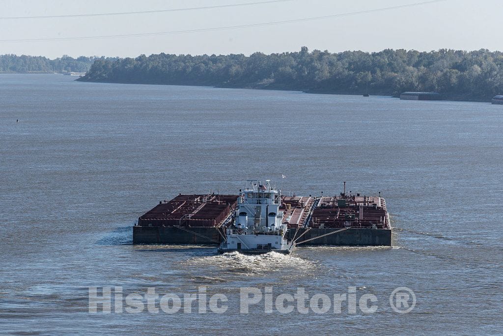 Photo - A tugboat pushes a wide barge upstream on the Mississippi River in the waters between Tunica County, Mississippi, and Phillips County, Arkansas- Fine Art Photo Reporduction