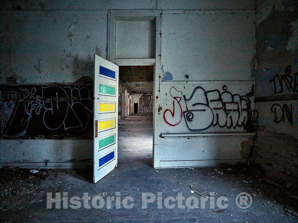 Photo - Graffiti-covered walls and eccentrically painted doorway in the empty and abandoned Hattiesburg High School building in Hattiesburg, Mississippi