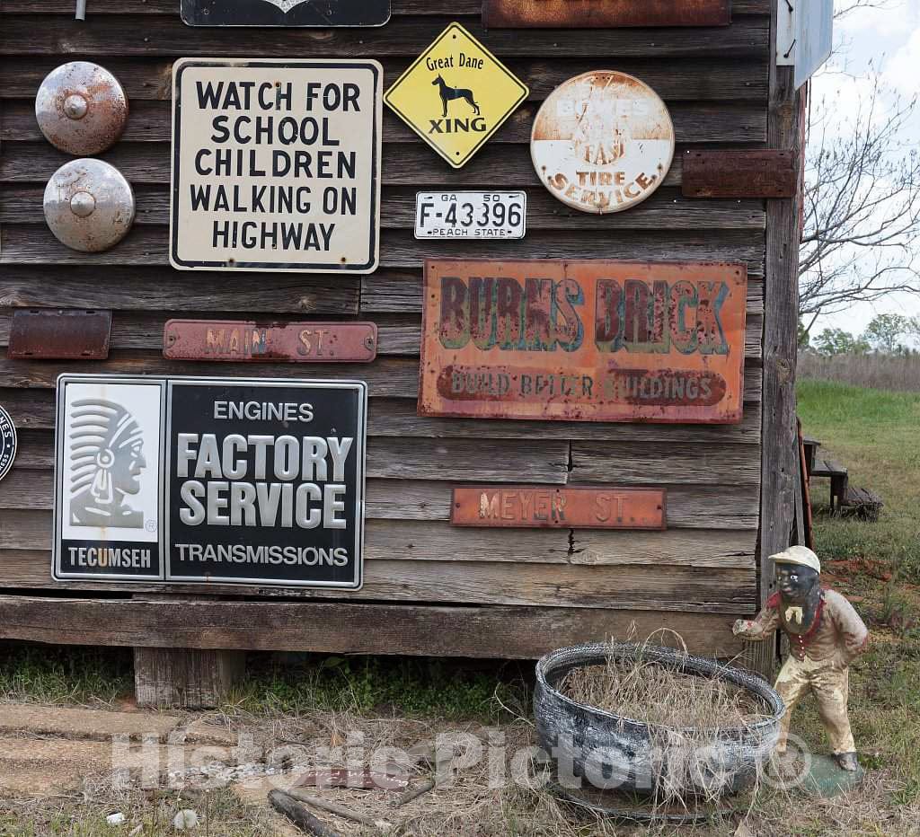 Photo- Portion of a barn in Sumter County, Georgia, festooned with The owner's Collection of Old Signs 1 Fine Art Photo Reproduction