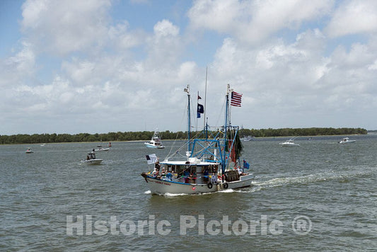 Photo- A Shrimp Boat Loaded with More Than Crustaceans and Crew, Passes by at The Annual Blessing of The Fleet of Shrimp Boats in The Atlantic Coast City of Mount Pleasant 2