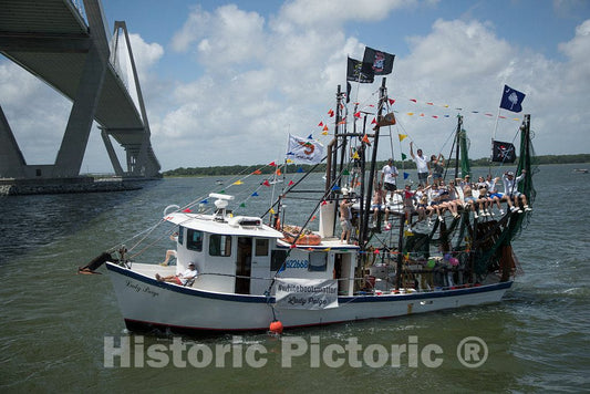 Photograph- The shrimp boat Lady Paige, loaded with more than crustaceans and crew, passes by at the annual Blessing of the Fleet of shrimp boats in the Atlantic Coast city of Mount Pleasant,