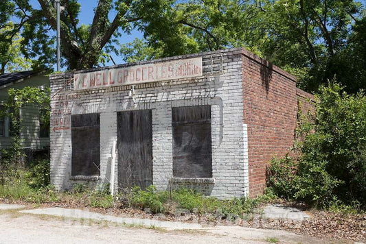 Photo- Old Grocery Store in a poorer Neighborhood of Aiken, South Carolina. Note The Curious Message on The Facade, Pointing Out That appliances were Sold Out The Back Door