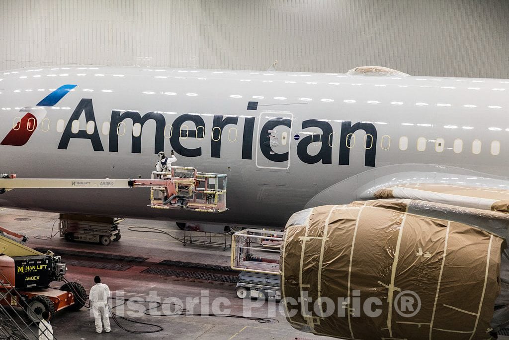 Photo- Workers complete painting a new aircraft at Boeing South Carolina, an assembly site for Boeing's Commercial Airplanes division in North Charleston, South Carolina 1