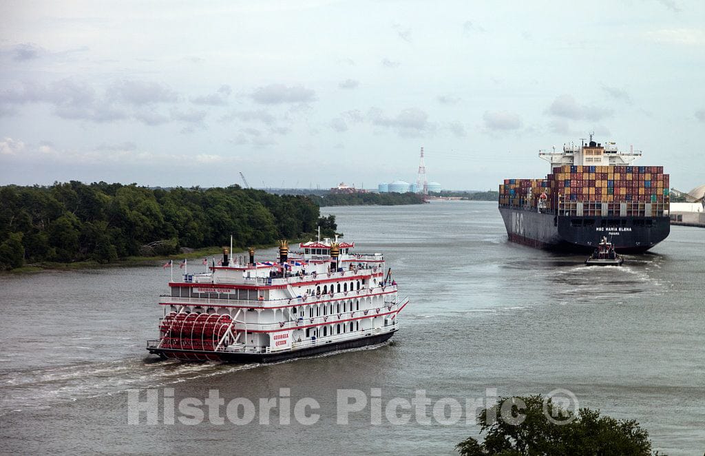 Photo - The Georgia Queen tourist paddlewheel riverboat and a heavily laden oceangoing container ship share a bend on the busy Savannah River in Savannah, Georgia