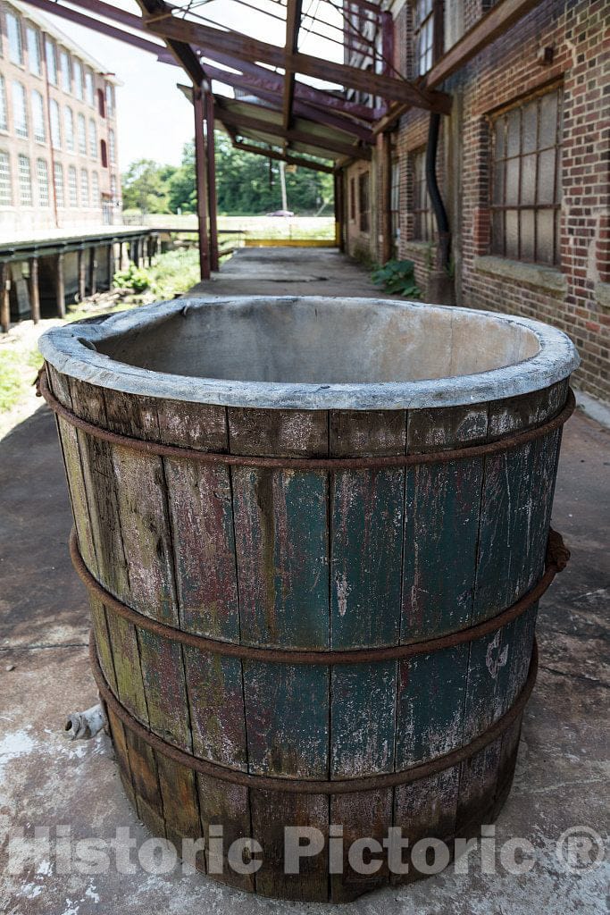 Photo- Weathered bucket outside the old Cone Mills's White Oak plant established in 1891 as a factory making flannel goods, and purchased by the Cone Brothers in 1905 in Greensboro