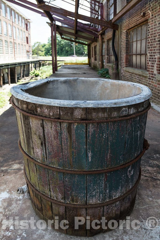 Photo- Weathered bucket outside the old Cone Mills's White Oak plant established in 1891 as a factory making flannel goods, and purchased by the Cone Brothers in 1905 in Greensboro