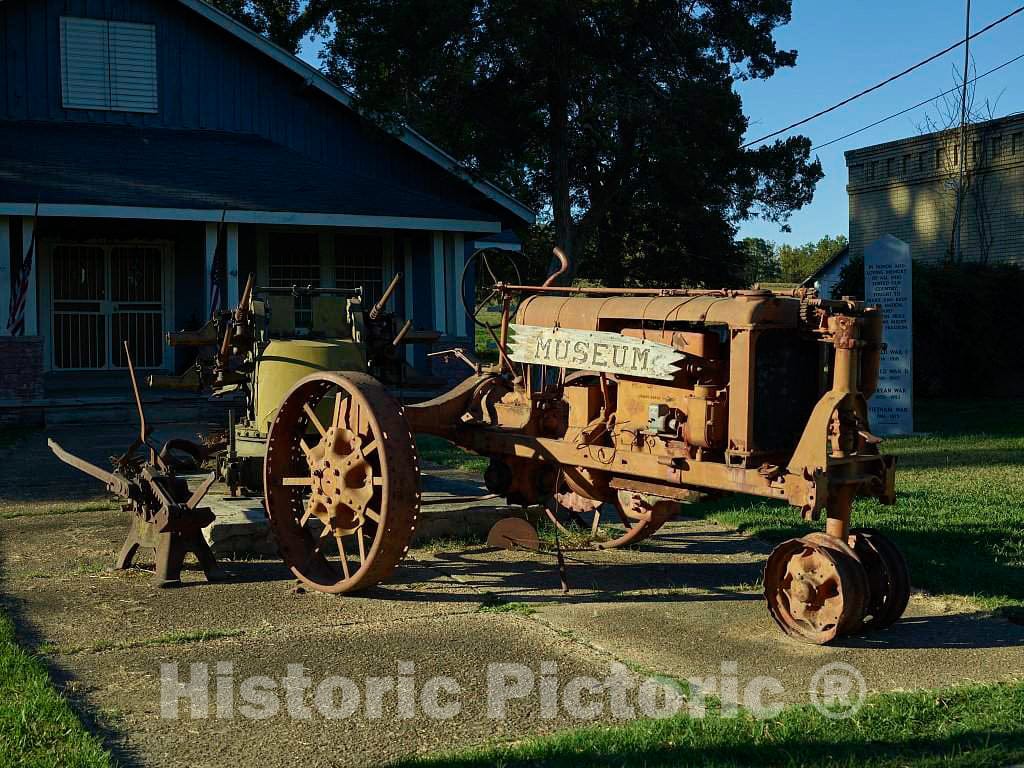 Photo - An old tractor stands outside the North Delta Museum in Friars Point, Mississippi, the hometown of country-music singing legend Conway Twitty- Fine Art Photo Reporduction