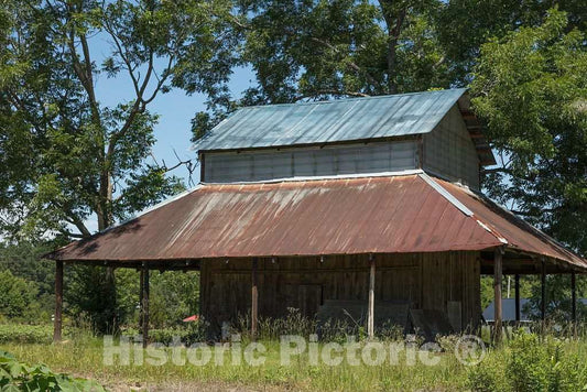 Photo- Classic Old, Rusted Georgia barn Near with a sloped Covering for Farm Machinery and hay Rolls in Latta, South Carolina 1 Fine Art Photo Reproduction