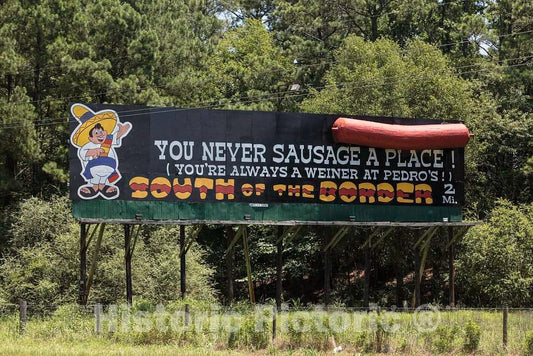 Photo- Catchy Sign touting an Attraction just Ahead on The Highway: an Unapologetically Tourist-Centered Shopping Extravaganza, with a Theme-Park Flair but Minus The Rides