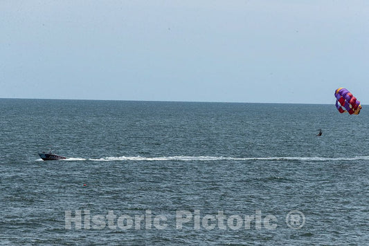 Photo - A Speedboat pulls a Person Attached to a Hang Glider Along The Shore at Myrtle Beach, South Carolina- Fine Art Photo Reporduction