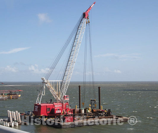 Photo - Large crane, part of the complex at work to build a second bridge span over the Oregon Inlet in Cape Hatteras, a community on North Carolina's Outer Banks