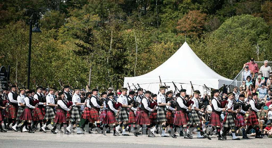 Photo - Bagpipers Parade at The Annual New Hampshire Highland Games and Festival in Lincoln, a Gathering Filled with Pipes, Drums, Dancing, Stone Lifting and Throwing