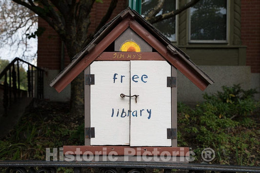 Photo - A"birdhouse library." A a small, birdhouse-shaped free container into which books can be donated and freely taken- Fine Art Photo Reporduction