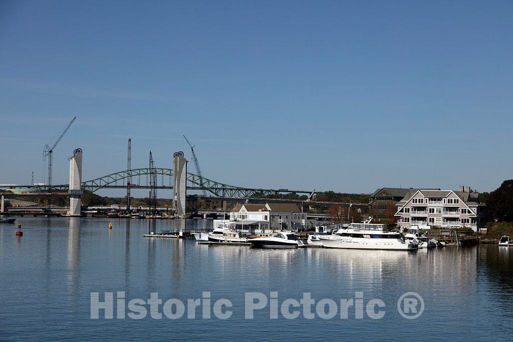 Photo- Vessels dock next to The Pointe Restaurant on Badger's Island, a small island in Maine waters on the Piscataqua River separating Portsmouth, New Hampshire, and Kittery, Maine