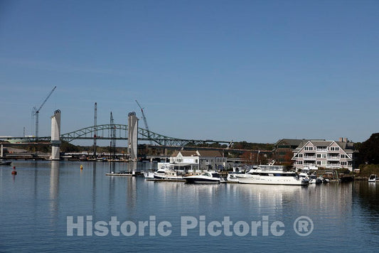 Photo- Vessels dock next to The Pointe Restaurant on Badger's Island, a small island in Maine waters on the Piscataqua River separating Portsmouth, New Hampshire, and Kittery, Maine