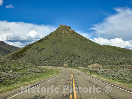 Photo - A Road That Separates Wyoming (Left) from Colorado, Near The Wyoming Town of Savery. Squaw Mountain, Ahead, is considered a Local Landmark in Both States