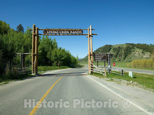 Photo- Entrance gate at Spring Creek Resort Ranch on The Edge of Grand Teton National Park and a Wildlife Reserve Beneath The Teton Mountain Range in Jackson Hole, Wyoming