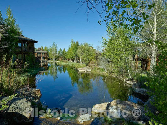 Photograph- Pond outside a guest cabin at Spring Creek resort ranch on the edge of Grand Teton National Park and a wildlife reserve beneath the Teton Mountain Range in Jackson Hole, Wyoming