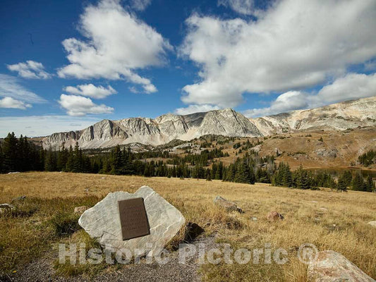 Photo- A plaque pays tribute to 66 passengers and crew who died in a plane crash of United Airlines Flight 409 in 1955 on the distant Medicine Bow Peak in the Snowy Range