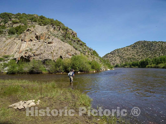 Photo - A fisher tries his luck at the A Bar A guest ranch, just over the Colorado border near Riverside in Carbon County, Wyoming- Fine Art Photo Reporduction