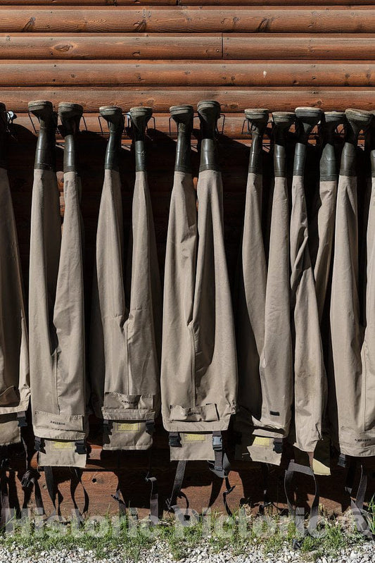 Photo- Chest-high Boots Called Waders Hang from The A Bar A ranch's Fish Shack, puckishly Called The Liars' Lair, Fishers are Prone to Exaggerating The Size of Fish Caught 1