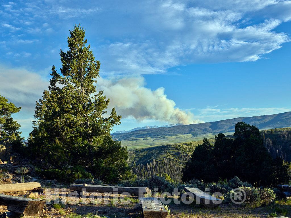 Photo- Smoke from More Than a Campfire Rises into The Sky in The Distance as seen from The Cookout Area of The A Bar A Guest Ranch, Near Riverside in Carbon County, Wyoming