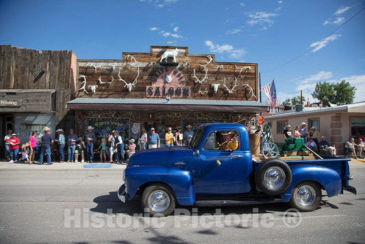 Photo - A Truck Passes The White Wolf Saloon in Douglas, Wyoming During The Wyoming State Fair's Annual Kickoff Parade- Fine Art Photo Reporduction