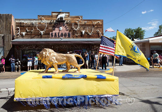 Photo - A Local Lions Club Float Passes The White Wolf Saloon in Douglas, Wyoming During The Wyoming State Fair's Annual Kickoff Parade- Fine Art Photo Reporduction