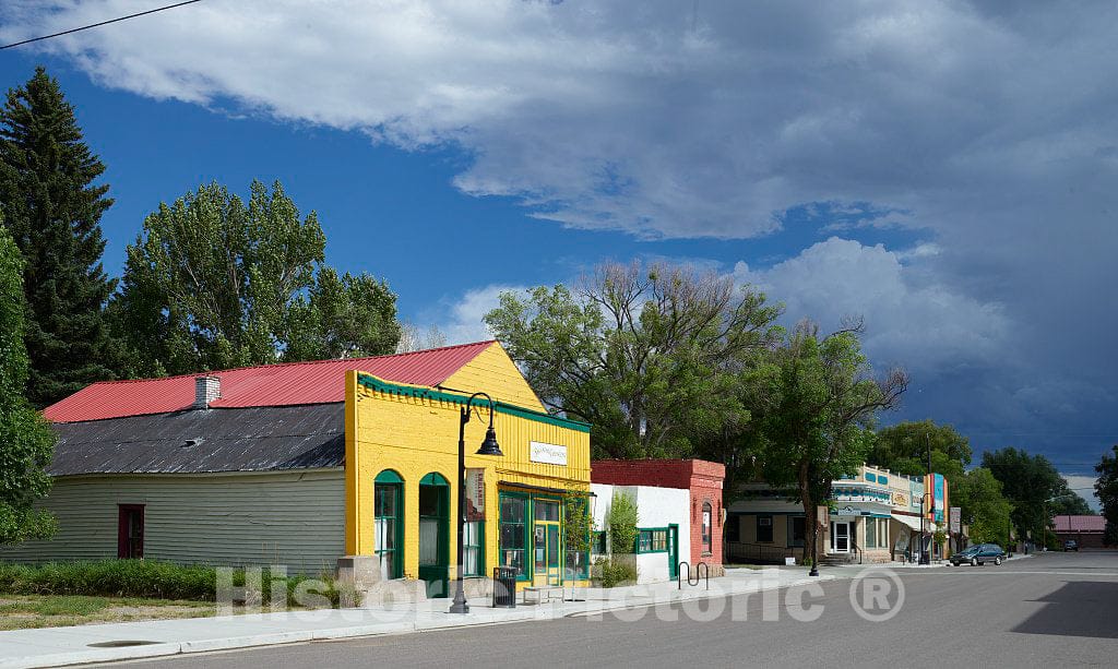 Photo - Colorful main street, including the offices of the Saguache Crescent newspaper in the bright yellow building, in Saguache, Colorado- Fine Art Photo Reporduction