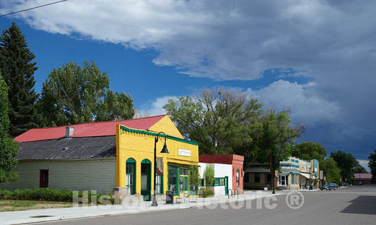 Photo - Colorful main street, including the offices of the Saguache Crescent newspaper in the bright yellow building, in Saguache, Colorado- Fine Art Photo Reporduction