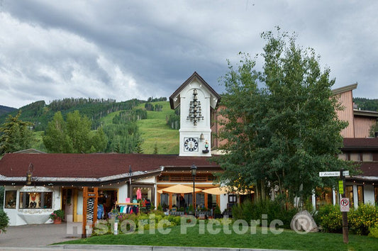 Photo- This bell tower atop the La Tour restaurant & bar, with not a single boomig bell but a number of tinkly ones, sounds melodically in the village square in Vail, Colorado