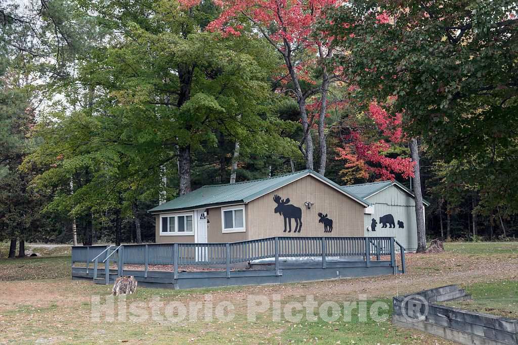 Photo- Each Cabin at The Along The Lake Resort, Along Sibley Pond Near Canaan, Maine, is Decorated with The Outlines of Local Wildlife or Human Figures in Relaxing situations